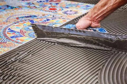 Laying floor ceramic tile Stock Photos