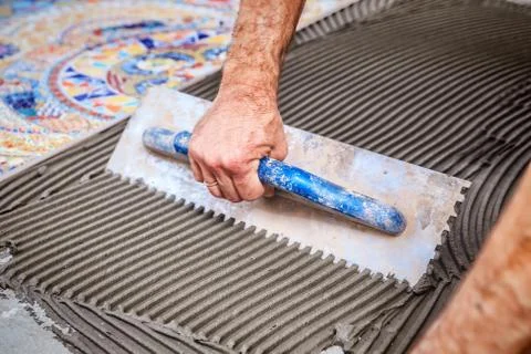 Laying floor ceramic tile Stock Photos