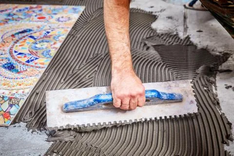 Laying floor ceramic tile Stock Photos