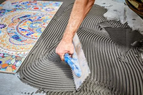 Laying floor ceramic tile Stock Photos