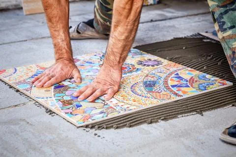 Laying floor ceramic tile Stock Photos