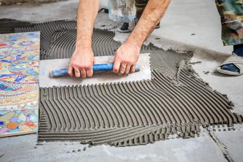 Laying floor ceramic tile Stock Photos