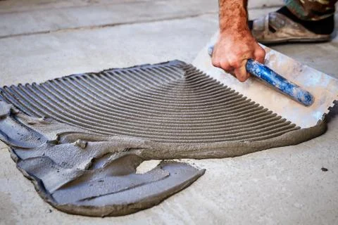 Laying floor ceramic tile Stock Photos