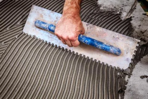Laying floor ceramic tile Stock Photos