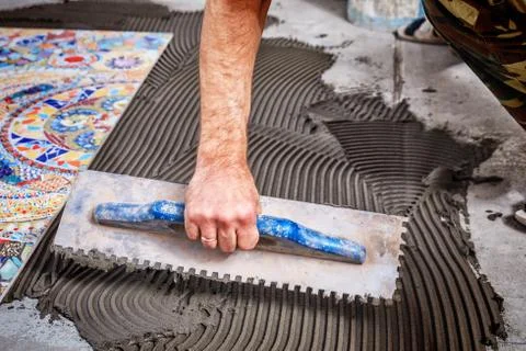 Laying floor ceramic tile Stock Photos