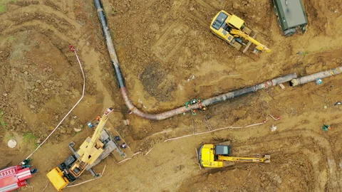Laying a gas pipe. top view Workers and equipment are laying the pipeline Stock Footage 200846241