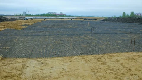 Laying geogrid for road construction Stock Footage 310521757