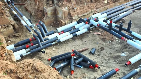 Laying a heating main pipe system underground. Replacement of old heating main Stock-Footage 254064355