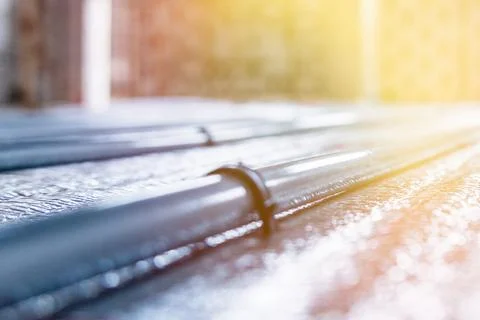 Laying Heating Systems: Installation of Underfloor Heating Pipes for Efficient Stock Photos