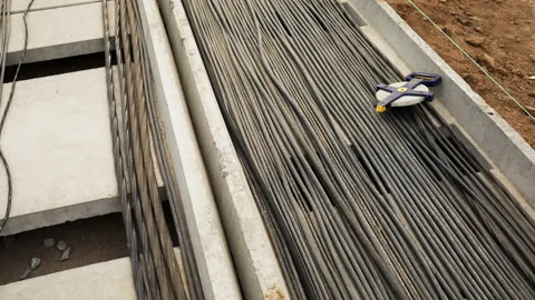 Laying of high voltage power cables into concrete duct Stockbeeldmateriaal 182088385
