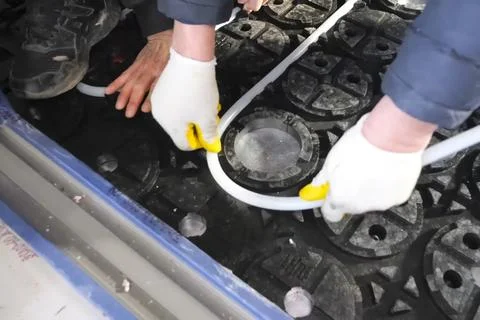 Laying of insulation elements and guides for underfloor heating system. Фото