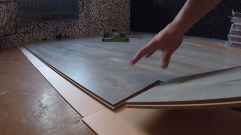 Laying laminate flooring1 Stock Footage 127777593