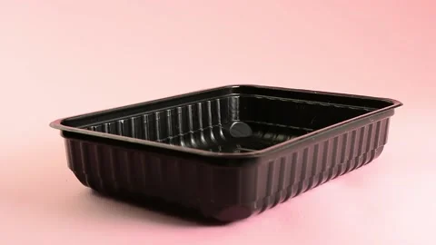 Laying the linen mat in a plastic container for sowing micro-greens Stock Footage 132962309