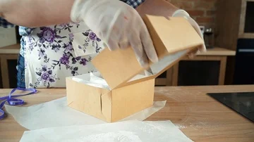 Laying marshmallows in a box 3 Stock Footage 85666975