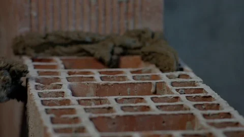Laying mortar for a bed for the bricks. Slow-motion Video stock 73361186