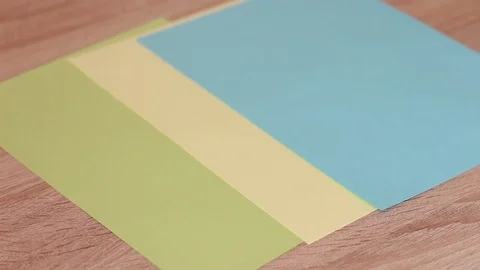 Laying out colorful paper on table 動画素材 86231985
