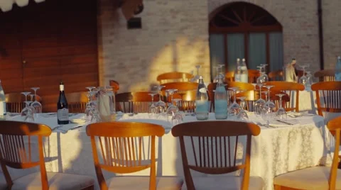 Laying out of the dinner table near the building like castle Stock Footage 66543221