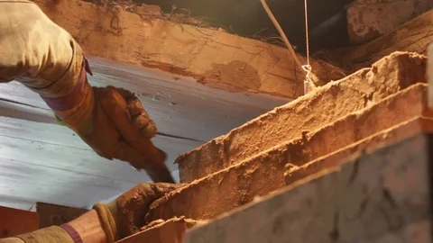 Laying oven. Building Composing Bricks With Cement Stock Footage 123710142