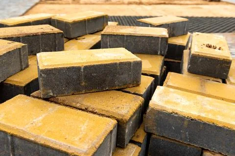 Laying the path with paving bricks. Street improvement. Construction of pedes Stock Photos