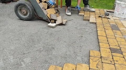 Laying paving slabs Stock Footage 325671541