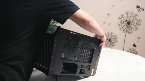 Laying personal computer case on its side panel before installing components Stock Footage 335069927