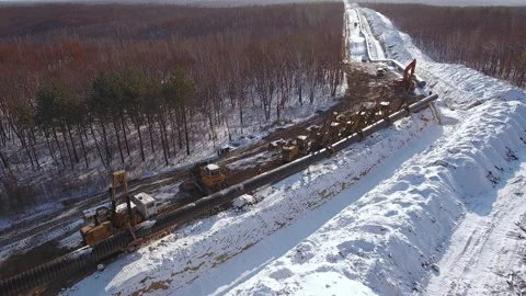 Laying a pipe in a trench Stock Footage 170919536