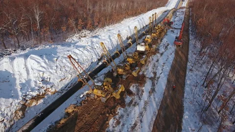 Laying a pipe in a trench, top view Stock Footage 170923649