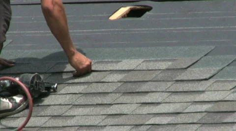 Laying Shingles On A Roof Stock Footage