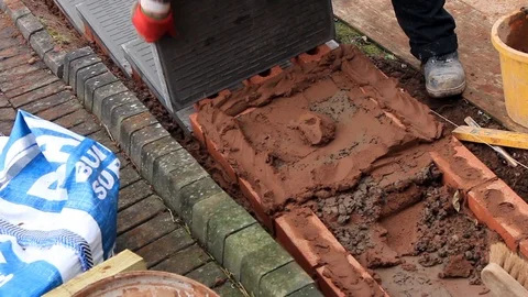 Laying a slab for garden steps Stock Footage 85513091