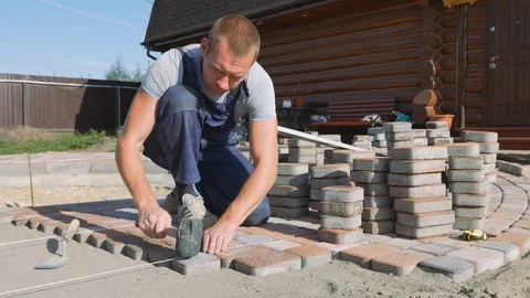 Laying stone pavers master Stock Footage 80392279