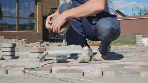 Laying stone pavers master Stock Footage 80394038
