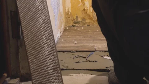 Laying tile on the floor Stock Footage 112144579