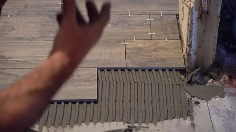 Laying tile on the floor Video stock 115729343