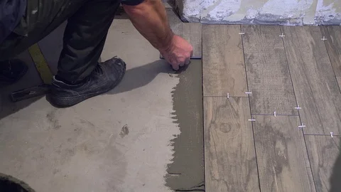 Laying tile on the floor Stock Footage 116338832