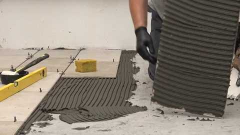 Laying tiles outside Stock Footage 111866963