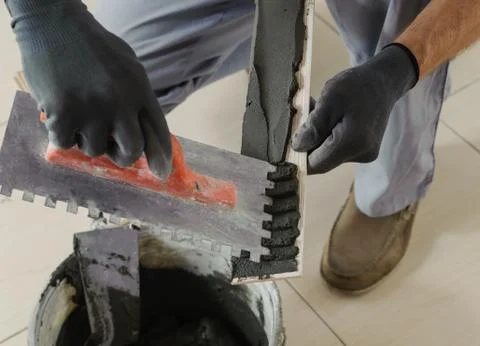 Laying the tiles. Stock Photos