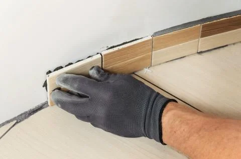 Laying the tiles. Stock Photos