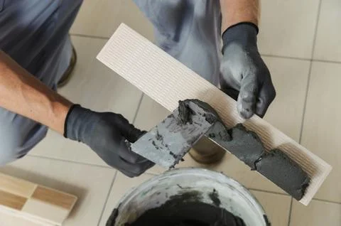 Laying the tiles. Stock Photos