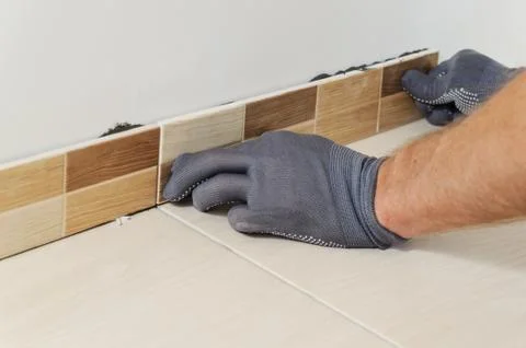 Laying the tiles Stock Photos