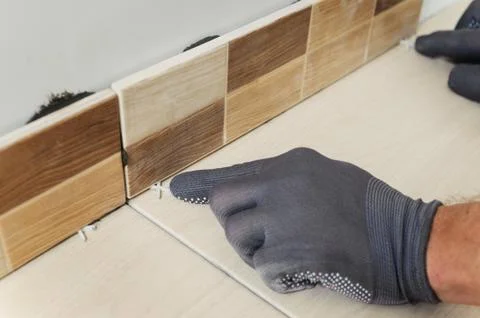 Laying the tiles Stock Photos