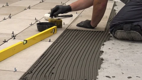 Laying tiles with yellow level Stock Footage 111866496