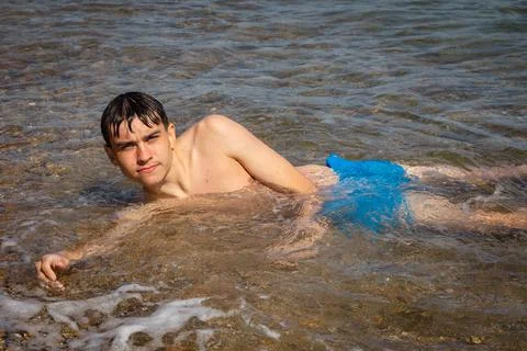 Laying in the waves Stock Photos