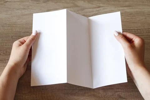 The layout of the booklet in the hands Stock Photos