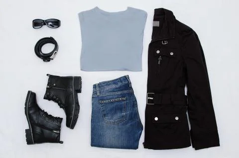 Layout clothes. Black jacket, boots, belt, glasses, jeans and a gray T-shirt. Stock Photos