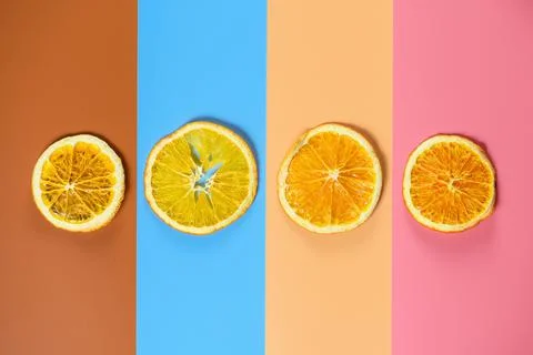 Layout of dried oranges on color background Stock Photos