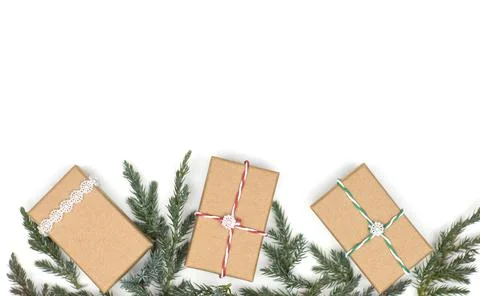 Layout, gift boxes with Christmas tree branches on a white background Stock Photos