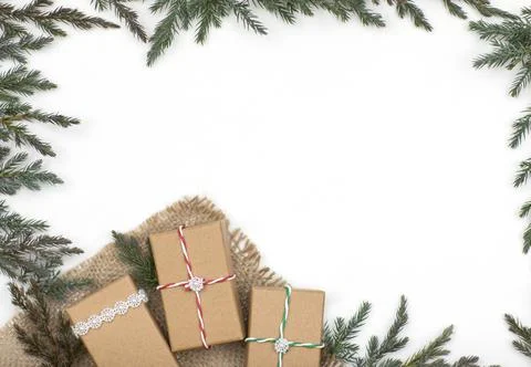 Layout, gift boxes with Christmas tree branches on a white background Stock Photos
