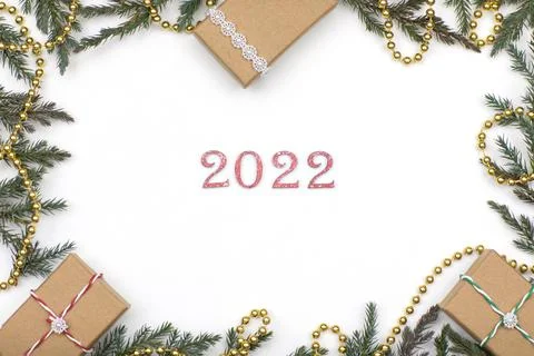 Layout, gift boxes with Christmas tree branches on a white background, 2022 Stock Photos
