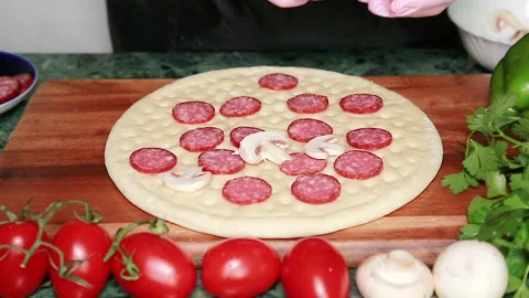 Layout of mushrooms for pizza Stock Footage 141766962