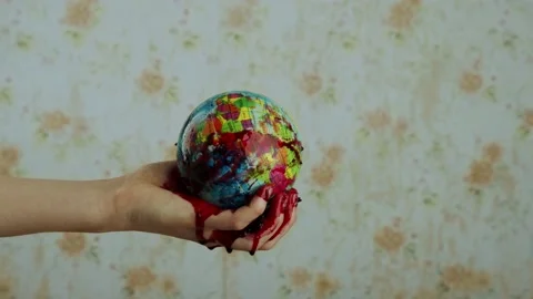 Layout of the planet in a bloody hand from which thick red blood flows Video stock 145038315